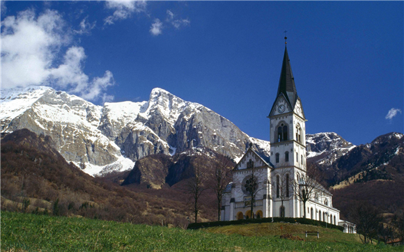 church and mountains